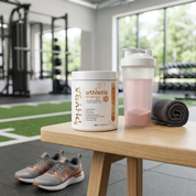 Athletic Energy with a pale pink drink in a training studio
