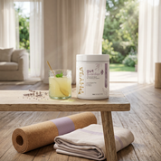 Gut Guardian with a pale yellow drink in a sunlit wellness setting